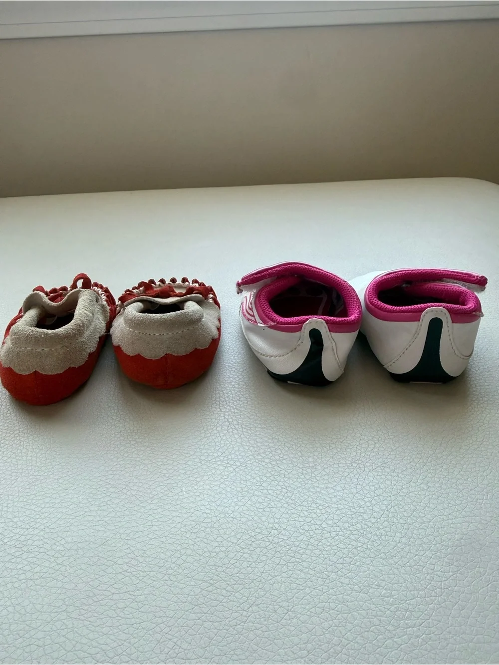 Puma White/ Pink Infant Slip-On Sneakers and brown baby moccasins with orange